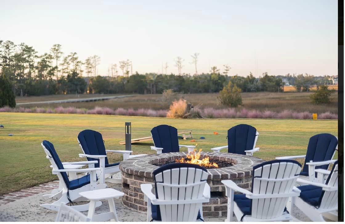 Adirondack chairs around a fire pit overlooking a golf course in Bluffton, South Carolina